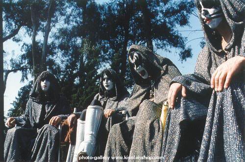 KISS dressed in wizard's robes for the press conference where they stupidly announce to the world that their talismen are their Achilles Heel.
