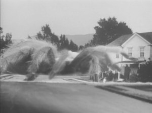 ... a giant spider whose size, color and opacity vary from scene to scene.