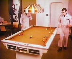 The Man poster in the background